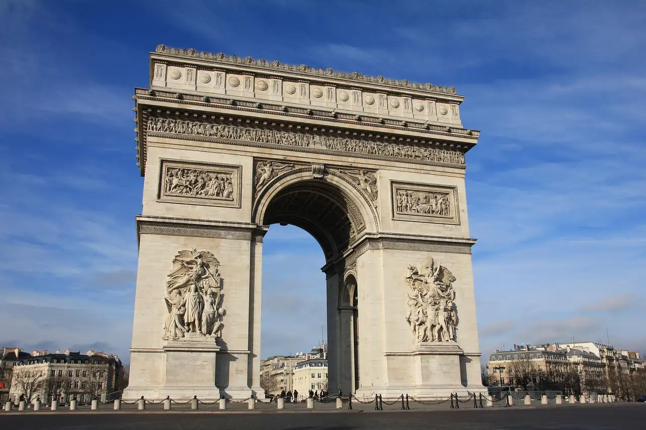 The Arc de Triomphe under a deep blue sky