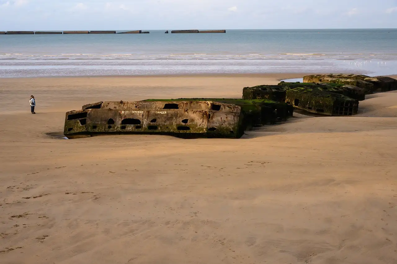 Concrete remains of the Mulberry harbour on the beach at Arromanches