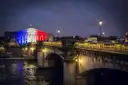 The Pont de la Concorde and the Assemblée nationale lit in the French colours at night