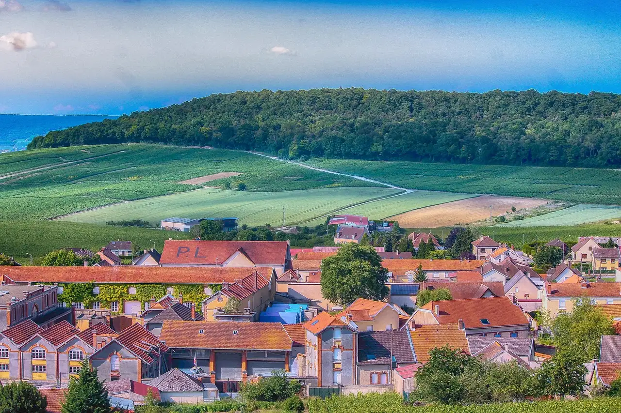 A champagne village at the foot of vine-covered hills