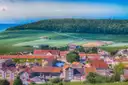 A champagne village at the foot of vine-covered hills