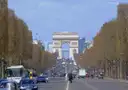 Traffic on the tree-lined Champs-Élysées with the Arc de Triomphe ahead