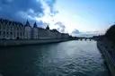 The Conciergerie and its towers along the Seine