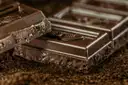 Broken pieces of a dark chocolate bar