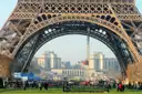 The base of the Eiffel Tower framing the Trocadéro on a sunny day