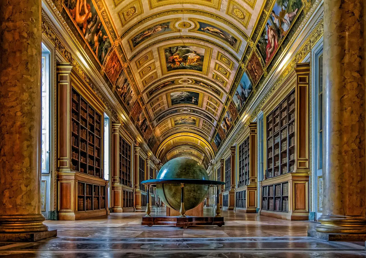 The Diana Gallery inside the Château de Fontainebleau, painted vaults above a long library