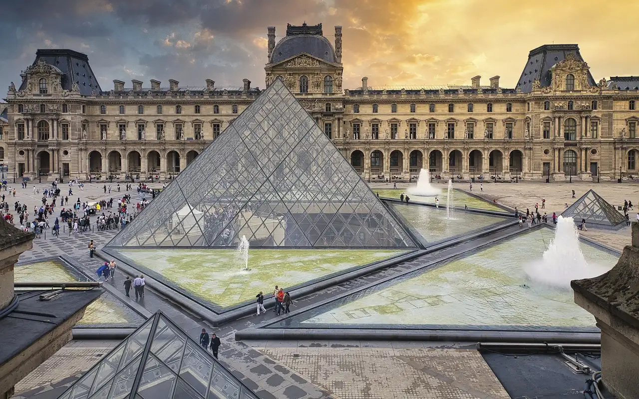 The Louvre courtyard with its glass pyramid and fountains seen from above