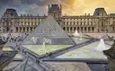 The Louvre courtyard with its glass pyramid and fountains seen from above