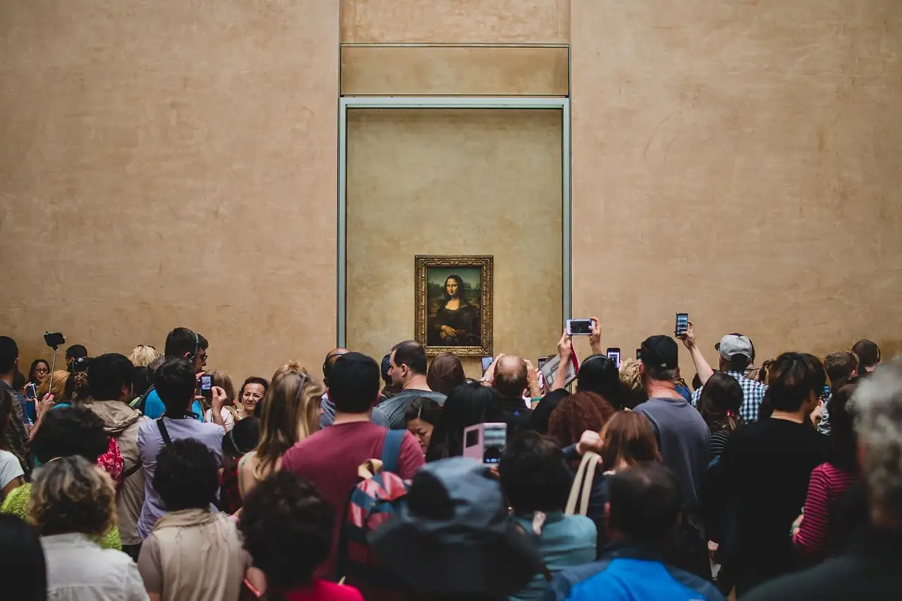 Visitors crowding in front of the Mona Lisa in the Louvre