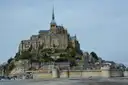 Mont-Saint-Michel's abbey, village and ramparts rising above the tidal flats