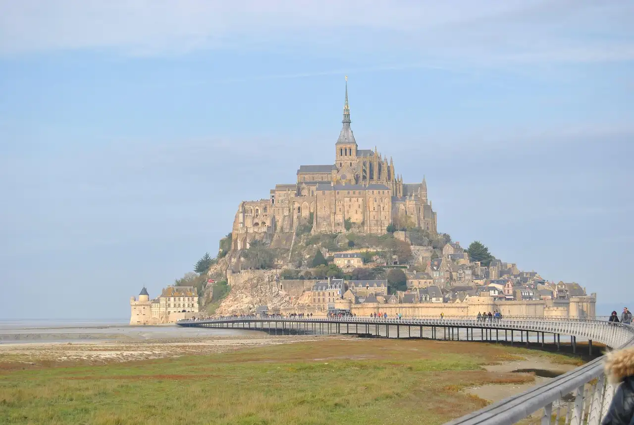 Mont-Saint-Michel with its access bridge and salt meadows