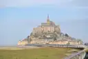 Mont-Saint-Michel with its access bridge and salt meadows