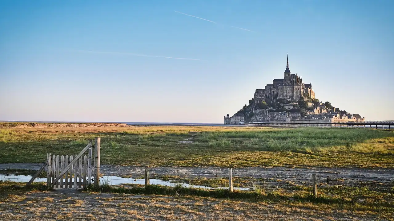 Mont-Saint-Michel beyond the salt meadows under a clear sky