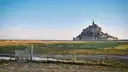 Mont-Saint-Michel beyond the salt meadows under a clear sky