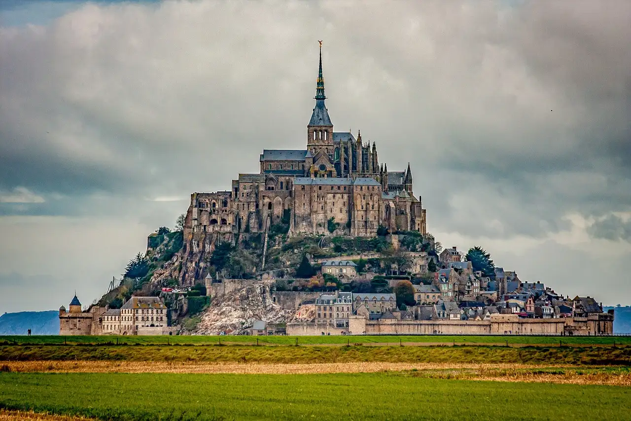 Mont-Saint-Michel rising above green meadows