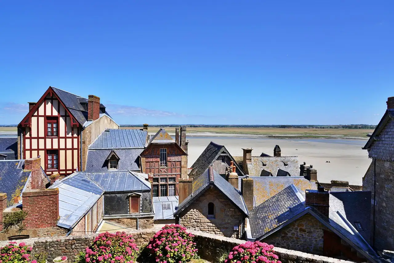 Rooftops of the village inside Mont-Saint-Michel, with the bay behind