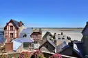 Rooftops of the village inside Mont-Saint-Michel, with the bay behind