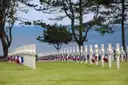 White crosses in rows at the Normandy American Cemetery above the sea