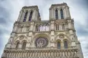 The carved west front and rose window of Notre-Dame seen from below