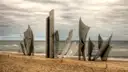 The Les Braves steel memorial on the sand of Omaha Beach in Normandy