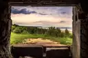 The coast above Omaha Beach seen through the opening of a German bunker