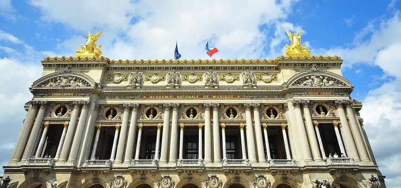 The gilded roofline and columned front of the Palais Garnier opera house