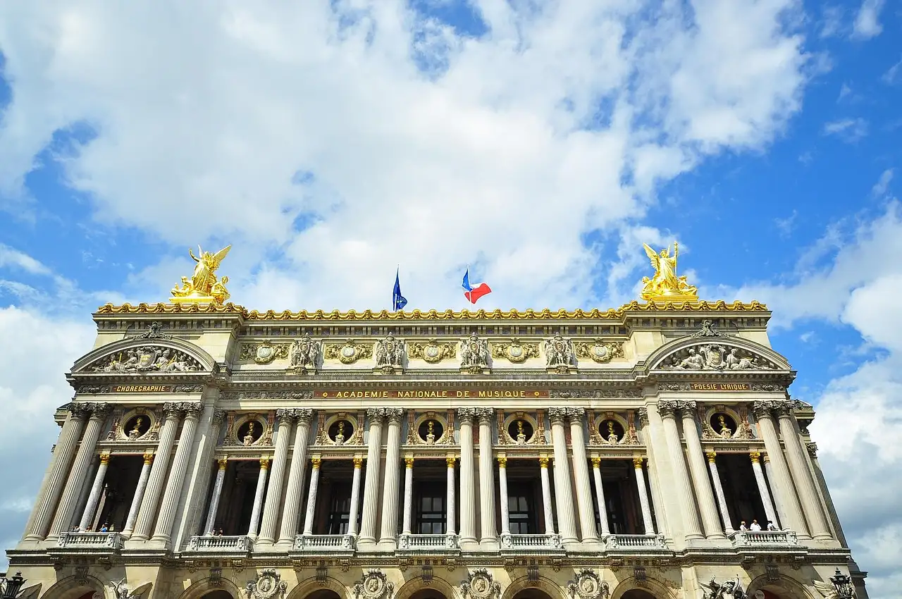 The gilded roofline and columned front of the Palais Garnier opera house