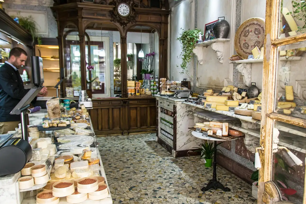 Counters of cheese inside an old Paris cheese shop