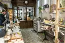 Counters of cheese inside an old Paris cheese shop