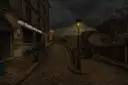 A cobbled Montmartre lane with a lit street lamp under a dark, stormy sky