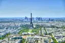 Paris from above with the Eiffel Tower and the towers of La Défense behind