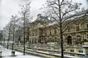The Luxembourg Palace in Paris with snow on the trees and terrace walls