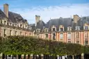 The red-brick houses of Place des Vosges in the Marais