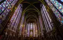 The apse of Sainte-Chapelle ringed by tall stained-glass windows