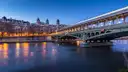 The Bir-Hakeim bridge and the Seine lit up at blue hour