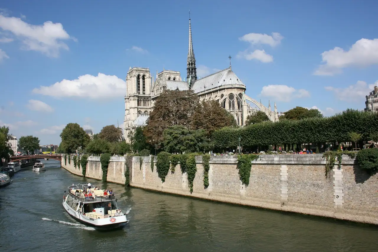 A river boat on the Seine passing below Notre-Dame cathedral