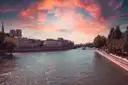 The Seine at twilight under a red evening sky