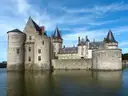The Château de Sully-sur-Loire reflected in its moat