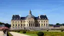 The domed Château de Vaux-le-Vicomte behind its clipped parterre gardens