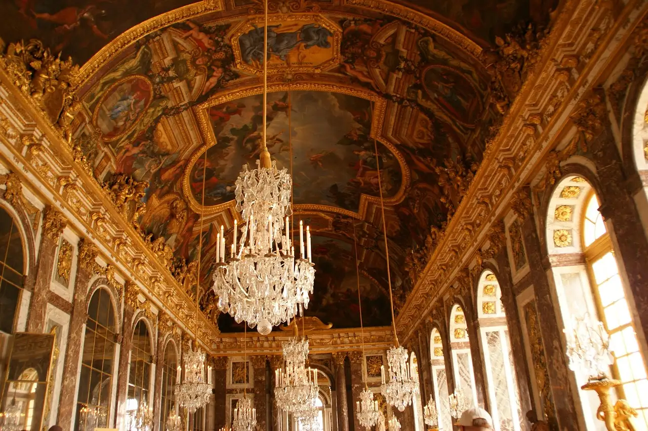 The Hall of Mirrors at Versailles, crystal chandeliers under the painted vaulted ceiling