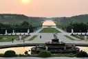 The Latona Fountain and the garden avenue to the Grand Canal at Versailles at sunset