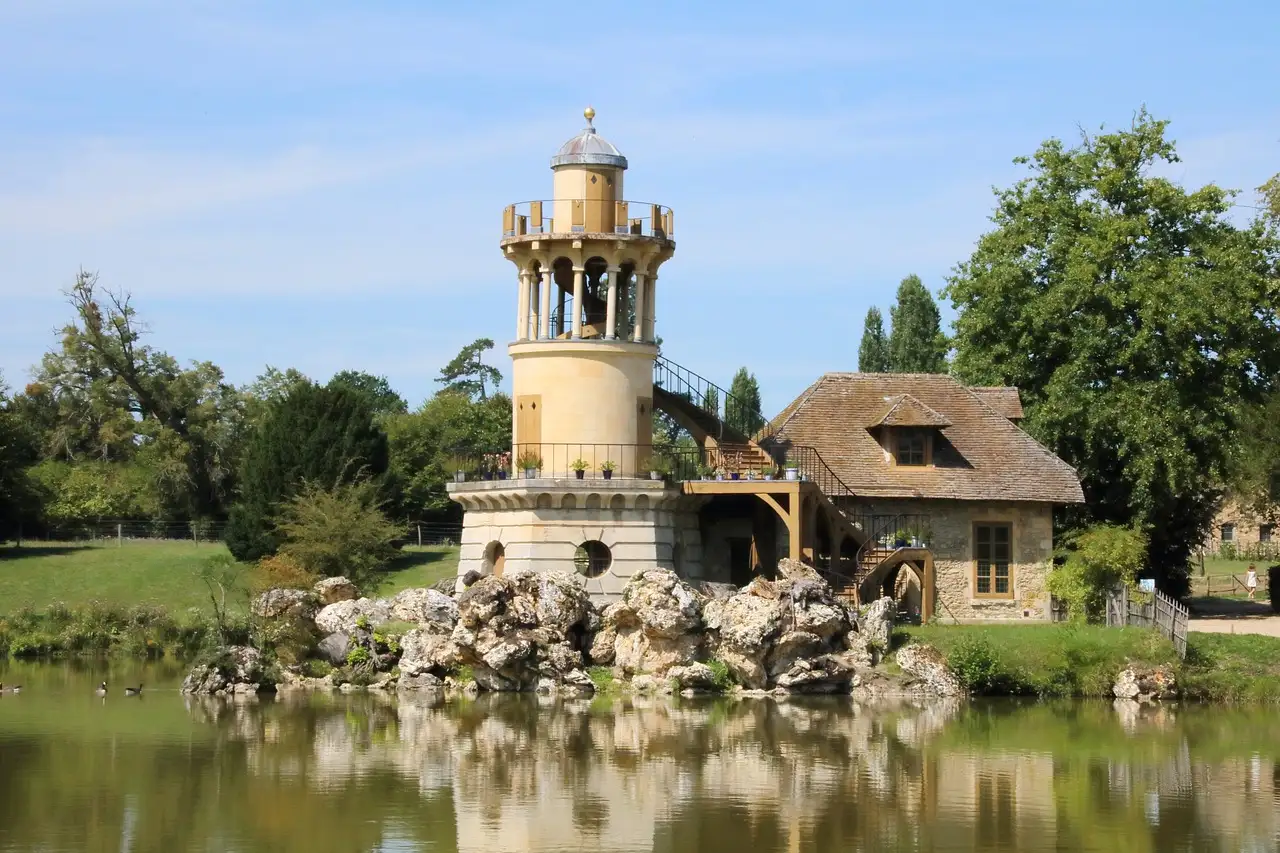 The Marlborough Tower beside the pond at the Queen's Hamlet in Versailles