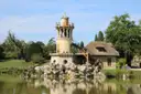 The Marlborough Tower beside the pond at the Queen's Hamlet in Versailles