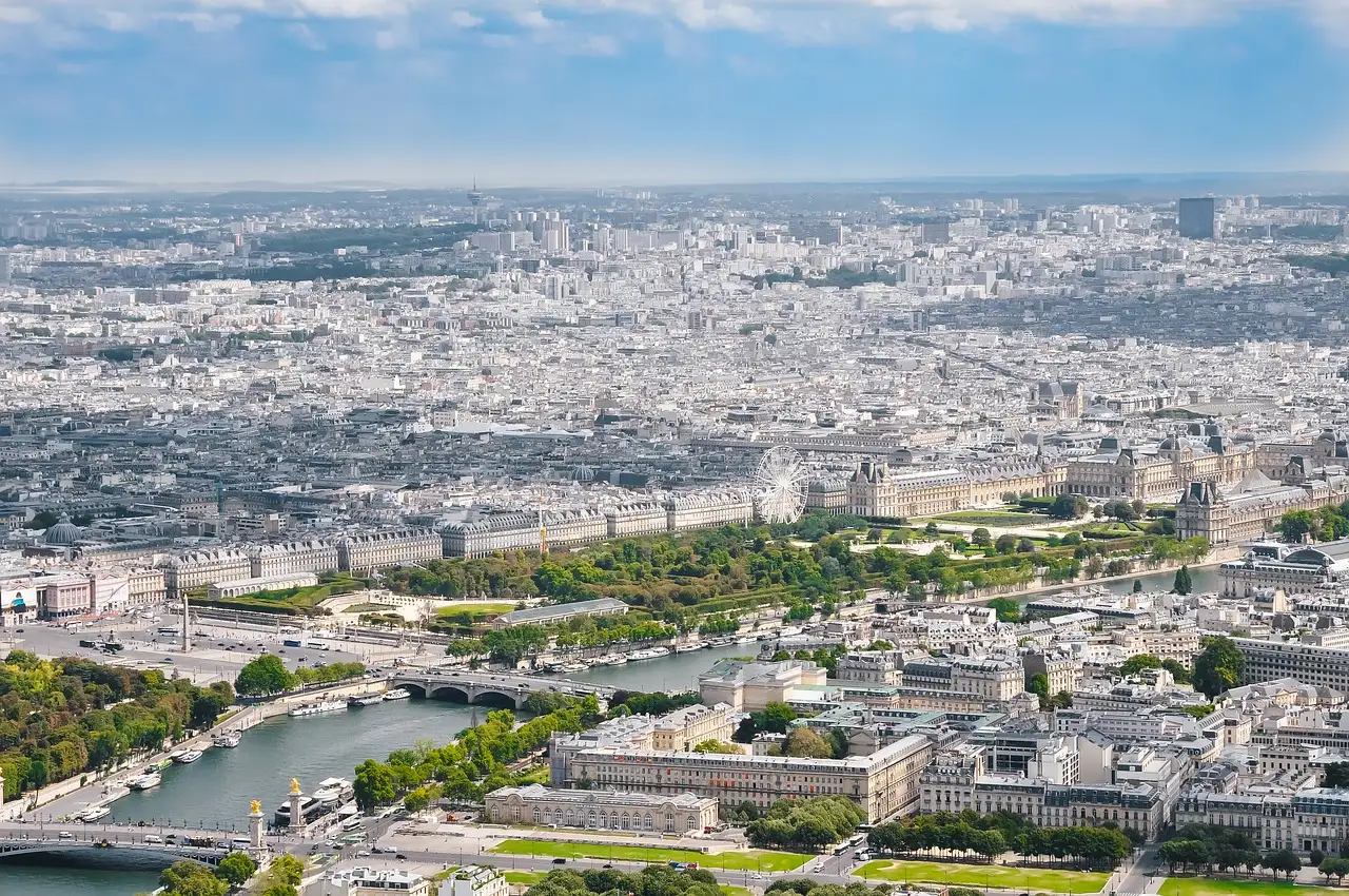 View from the Eiffel Tower across the Seine and its bridges to the rooftops of Paris