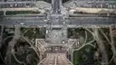 Looking straight down from the Eiffel Tower onto the bridge, roads and gardens far below