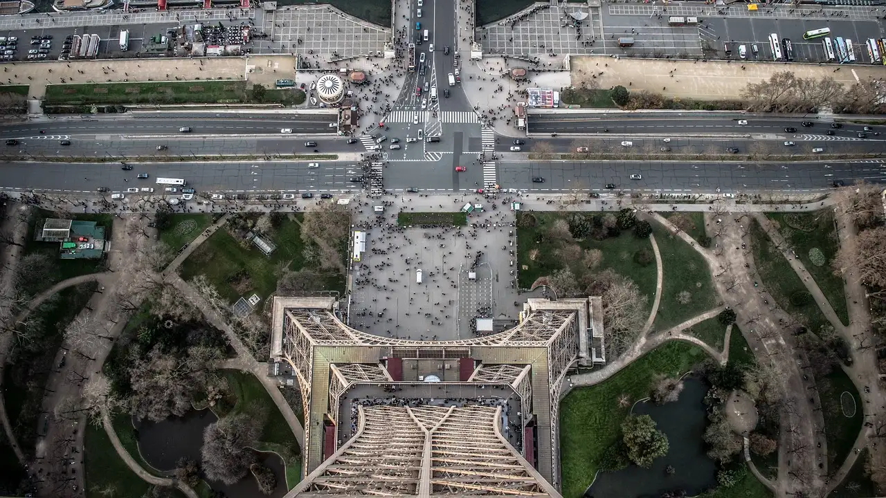 Looking straight down from the Eiffel Tower onto the bridge, roads and gardens far below